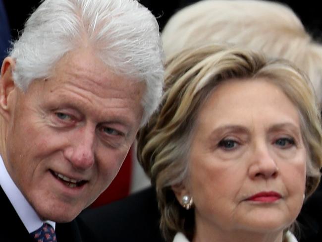 WASHINGTON, DC - JANUARY 20: Former President Bill Clinton and former Democratic presidential nominee Hillary Clinton stand on the West Front of the U.S. Capitol on January 20, 2017 in Washington, DC. In today's inauguration ceremony Donald J. Trump becomes the 45th president of the United States.   Joe Raedle/Getty Images/AFP == FOR NEWSPAPERS, INTERNET, TELCOS & TELEVISION USE ONLY ==