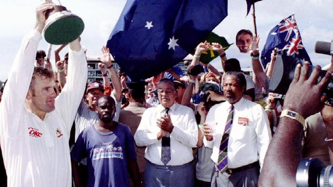 Australian captain Mark Taylor holds Frank Worrell trophy after the fourth test win secured the series.