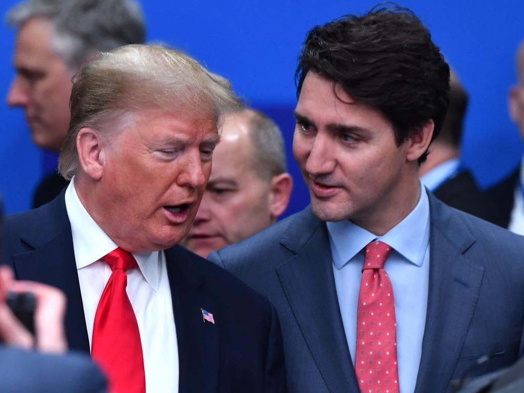 Donald Trump (L) talks with Justin Trudeau during the plenary session of the NATO summit in December, but the two leaders have a rocky relationship. Picture: AFP