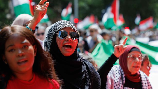 Pro-Palestinian supporters march through Sydney. Picture: David Swift