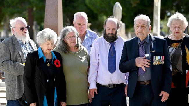 Mourners say a prayer during the solemn ceremony at West Terrace Cemetary. Picture: Naomi Jellicoe