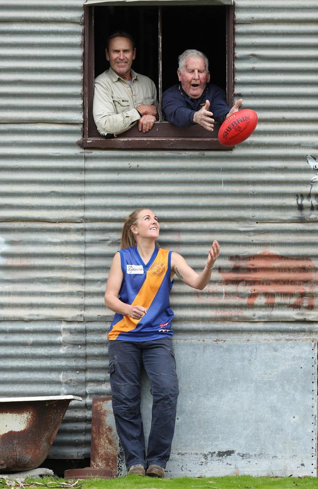 Casey McElroy on the family farm at Marcollat with her dad Bradley, 52 and grandfather Jeffrey, 81. Picture: Tait Schmaal