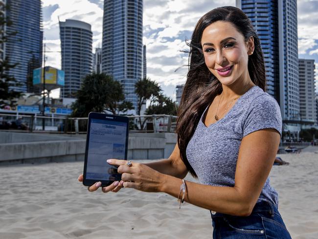 Charlotte Cush, from Robina, holding a Samsung tablet in Surfers Paradise, for the Gold Coast Bulletin's latest digital subscription promotion. Picture: Jerad Williams