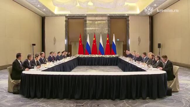 Putin and Xi Shake Hands as Belarus Joins Shanghai Cooperation Organization