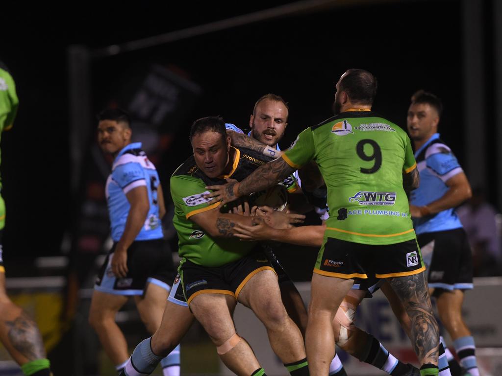 Northern Sharks Clinton Chettle tackles Palmerston Raiders in the NRLNT Grand Final 2022. Picture: (A)manda Parkinson