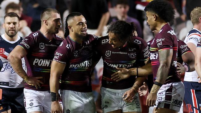 The Sea Eagles celebrate a try in their pride jersey against the Sydney Roosters last Thursday.