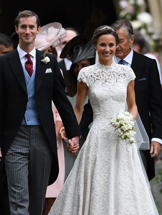 Pippa Middleton and James Matthews, with David Matthews following behind leave church following their wedding ceremony. Picture: Justin Tallis/Getty Images