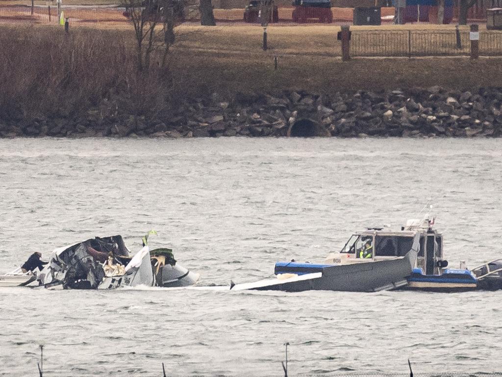 Recovery teams search the wreckage after the crash. Picture: Al Drago/Getty Images/AFP