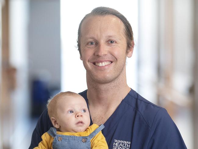 Registered Nurse Luke Glassington holds his 11 week old son Asher. Picture: Chris Kidd