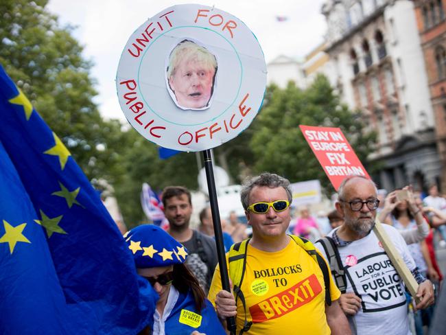 Anti-Brexit campaigners carry placards during the March for Change 'No to Boris:Yes to Europe' demonstration in central London on July 20, 2019. (Photo by Tolga Akmen / AFP)