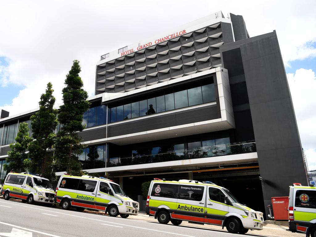 Ambulance crews prepare to transport quarantined guests from the Hotel Grand Chancellor in Spring Hill, Brisbane. Picture: Dan Peled