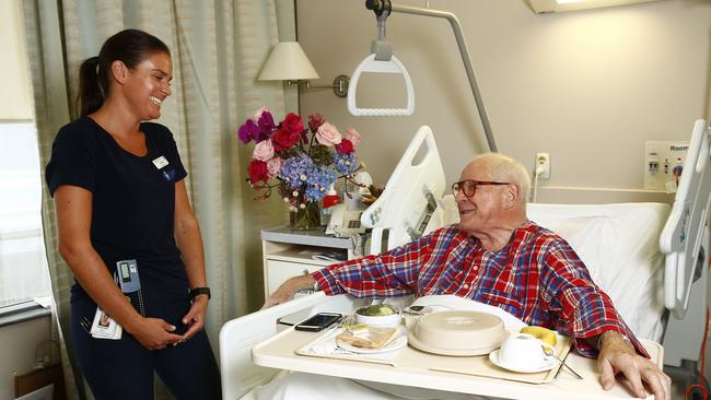 Nurse Courtney chats with patient Leo Schofield at St Vincent's Private Hospital.