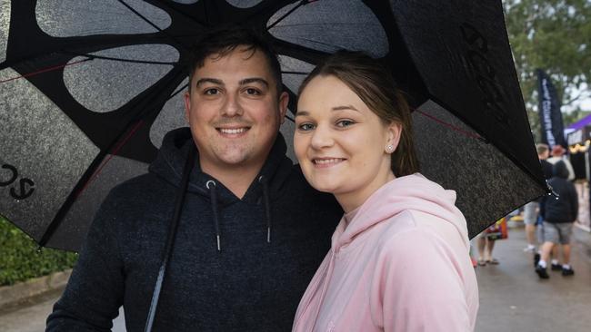 Anthony Eiser and Laura Murray had the umbrella up at the 2022 Toowoomba Royal Show. Picture: Kevin Farmer