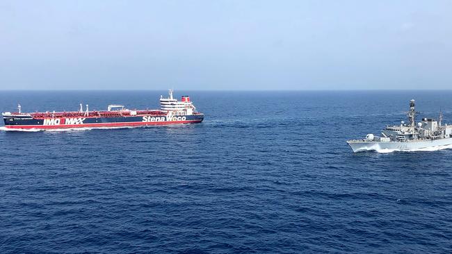 HMS Montrose, right, accompanying the Stena Important, left, vessel in the Gulf.