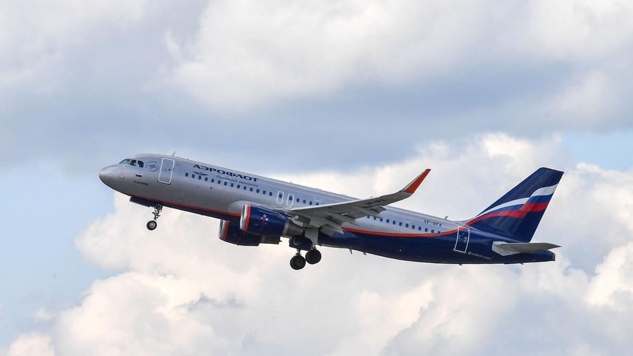 CORRECTION / An Aeroflot Airbus A320 aircraft takes off at Sheremetyevo airport outside Moscow on June 13, 2018. - Russia on February 27, 2022 closed its airspace to flights operated by carriers from Latvia, Lithuania, Estonia and Slovenia in tit-for-tat punitive measures following Moscow's invasion of Ukraine. Britain has banned Russian flagship carrier Aeroflot from flying over the UK. Meanwhile Bulgaria, Poland, the Czech Republic, the Baltics, Germany and Slovenia have closed their airspace to Russian carriers. (Photo by Yuri KADOBNOV / AFP) / â&#128;&#156;The erroneous mention[s] appearing in the metadata of this photo by Yuri KADOBNOV has been modified in AFP systems in the following manner: [Airbus A320] instead of [Airbus A330]. Please immediately remove the erroneous mention[s] from all your online services and delete it (them) from your servers. If you have been authorized by AFP to distribute it (them) to third parties, please ensure that the same actions are carried out by them. Failure to promptly comply with these instructions will entail liability on your part for any continued or post notification usage. Therefore we thank you very much for all your attention and prompt action. We are sorry for the inconvenience this notification may cause and remain at your disposal for any further information you may require.â&#128;&#157;