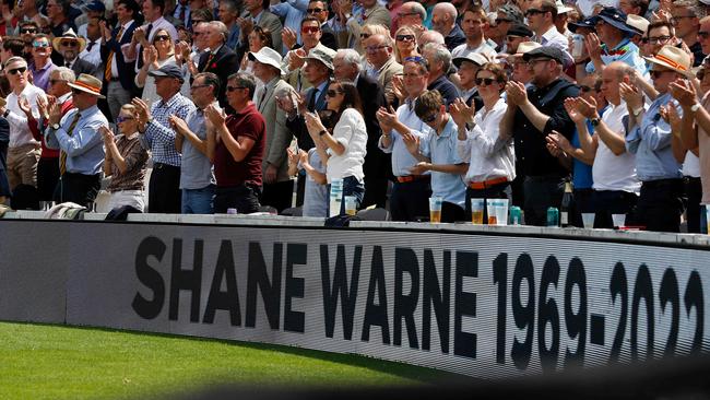 Spectators at Lord’s take a moment at the end of the 23rd over to applaud for 23 seconds to commemorate Australian cricketer Shane Warne. Picture: AFP