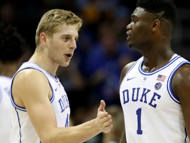 CHARLOTTE, NORTH CAROLINA - MARCH 16: Teammates Jack White #41 and Zion Williamson #1 of the Duke Blue Devils react against the Florida State Seminoles during the championship game of the 2019 Men's ACC Basketball Tournament at Spectrum Center on March 16, 2019 in Charlotte, North Carolina. (Photo by Streeter Lecka/Getty Images)