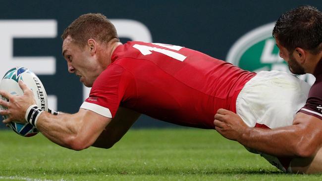 TOPSHOT - Wales' wing George North scores a try  during the Japan 2019 Rugby World Cup Pool D match between Wales and Georgia at the City of Toyota Stadium in Toyota City on September 23, 2019. (Photo by Adrian DENNIS / AFP)