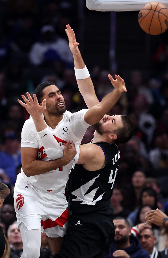 Jontay Porter battles Ivica Zubac for a rebound. Picture: Sean M. Haffey/Getty