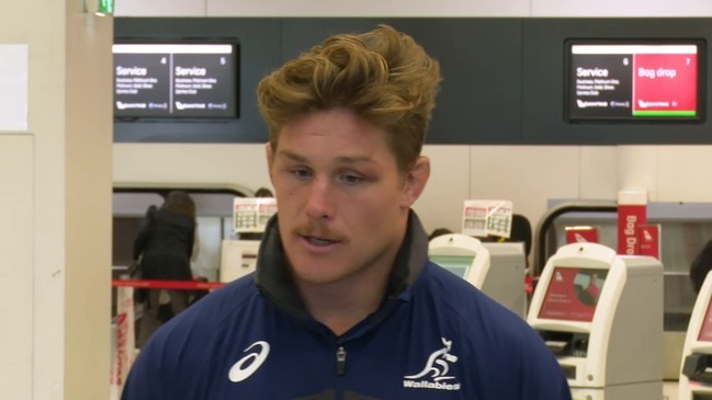 Wallabies captain Michael Hooper speaks to the media before boarding a plane for New Zealand