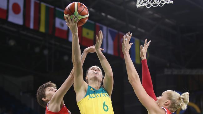 Stephanie Talbot of Australia shoots under pressure from Katsiaryna Snytsina (L) and Yelena Leuchanka (R) of Belarus.