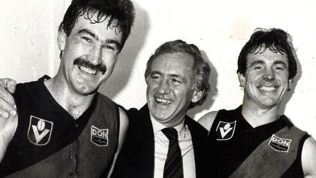 Bombers Roger Merrett and Terry Daniher with politician Andrew Peacock in 1983.