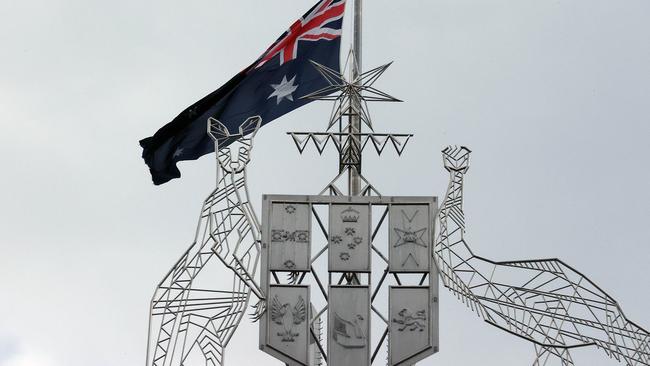 The ensign atop Parliament House in Canberra, Australia’s second most expensive building. Picture: NCA NewsWire / Gary Ramage