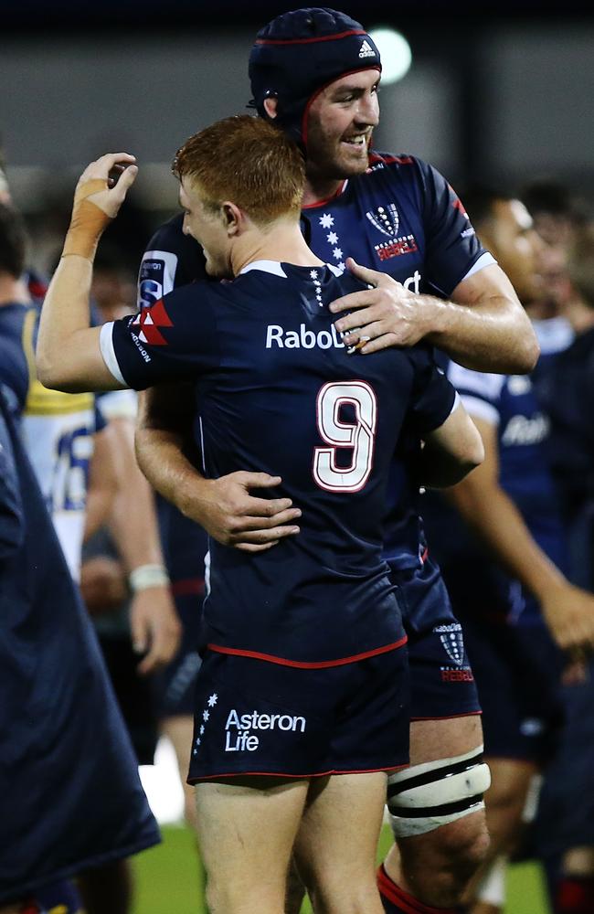 Tamati Ellison and Nick Stirzaker of the Rebels celebrate their historic victory.