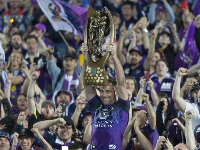 Cameron Smith of the Storm holds the trophy aloft after the NRL grand final between the Melbourne Storm and the North Queensland Cowboys at ANZ Stadium in Sydney, Sunday, October 1, 2017. (AAP Image/Craig Golding) NO ARCHIVING, EDITORIAL USE ONLY