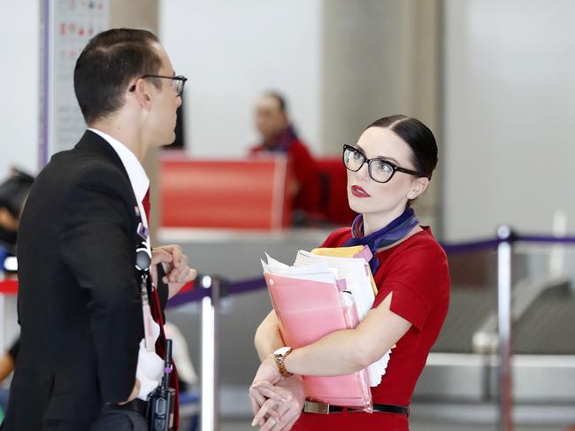 Virgin airlines pictured at the Brisbane Domestic Airport, Brisbane 25th of March 2020.  The Queensland border will be closed to all unnecessary travel as Virgin lets staff go due to the effect of Coronavirus (Covid-19).  (AAP Image/Josh Woning)