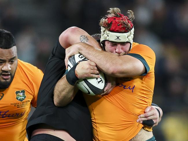 WELLINGTON, NEW ZEALAND - SEPTEMBER 28: Fraser McReight of Australia is tackled during The Rugby Championship & Bledisloe Cup match between New Zealand All Blacks and Australia Wallabies at Sky Stadium on September 28, 2024 in Wellington, New Zealand. (Photo by Hagen Hopkins/Getty Images)