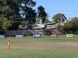 The chopper hovers above Morton Park.