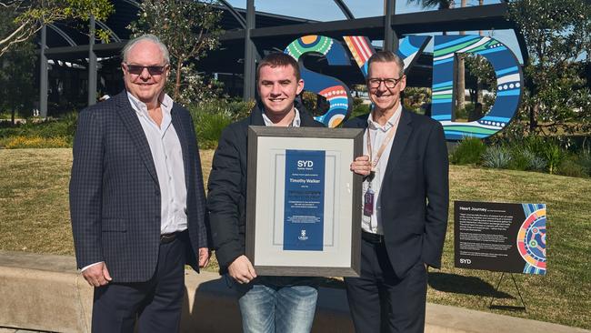 The first Indigenous recipient of the Sydney Airport 100 scholarship, Timothy Walker, pictured with former chairman Trevor Gerber (L) and airport CEO Geoff Culbert (R). Picture: Supplied