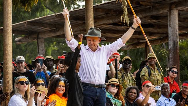 Anthony Albanese receives traditional gifts from a young Yolngu boy during Garma Festival 2022.