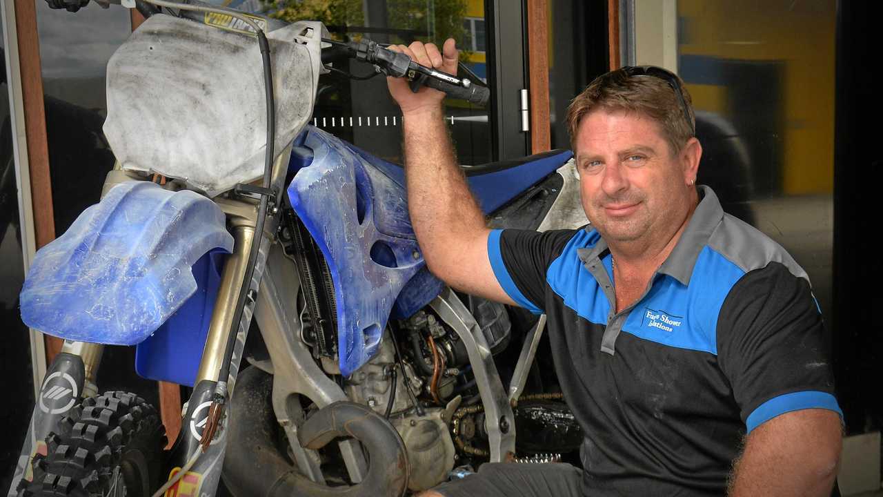 REUNITED: As the storms started raging early Thursday morning thieves broke into Mathew Brown's shop, stealing his custom racing dirt bike and some other goods, but thanks to social media he was quickly reunited with the bike. Picture: Patrick Woods