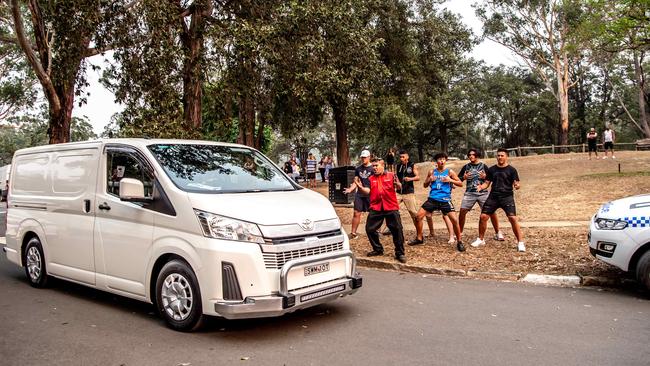 The Haka is performed as the van carrying the boy’s body is driven away. Picture: Monique Harmer