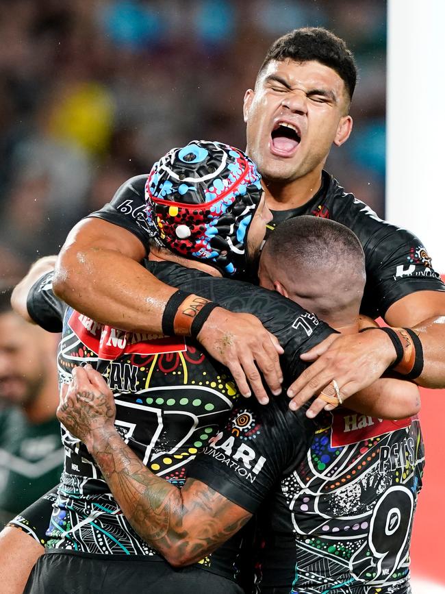 Josh Curran of the Indigenous All Stars is congratulated by his teammates after scoring a try during the NRL Indigenous All-Stars vs Maori Kiwis match at CBus Super Stadium on the Gold Coast back in February. (AAP Image/Dave Hunt)