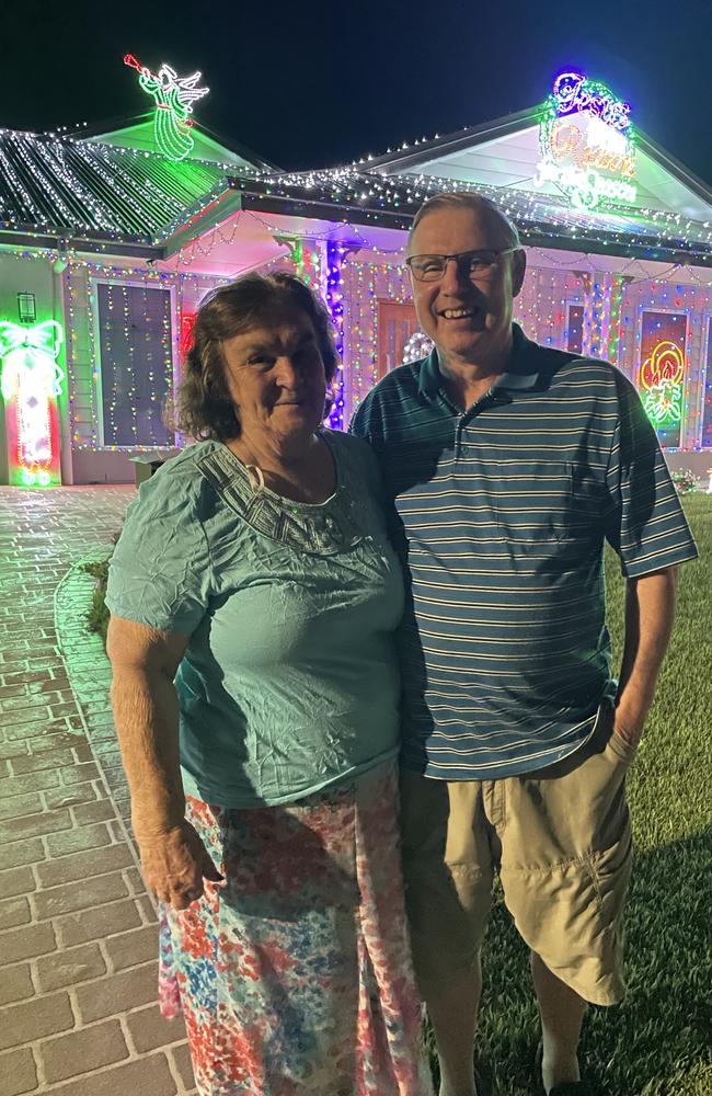 Paul and Diane Flanagan in front of their gorgeous Christmas lights at 9 Hinchinbrook Street, Morayfield. Picture: Aaron Goodwin