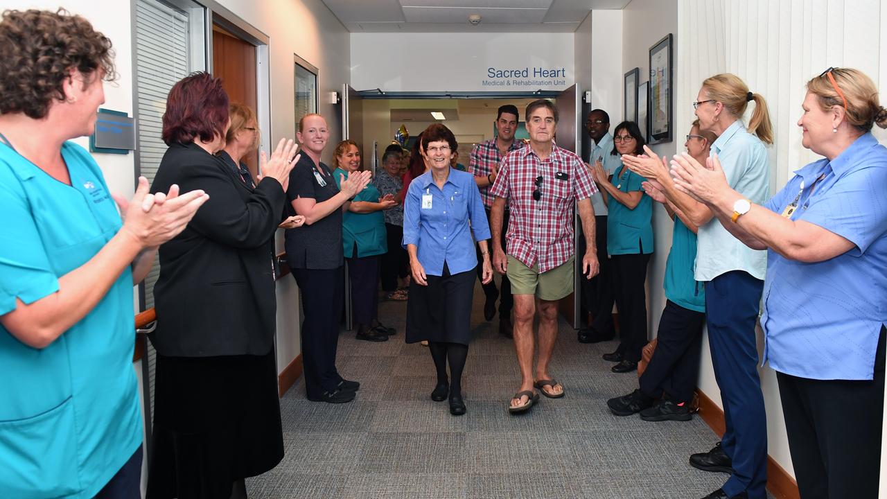 Marcia Begg is given a guard of honour as she leaves the Mater Hospital on her retirement. She was joined by her husband George, son Clinton and daughter Tania. Picture: Tony Martin