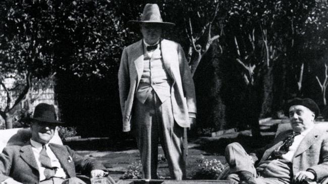 Author Somerset Maugham (left) is famously quoted as saying: “To acquire the habit of reading is to construct for yourself a refuge from almost all the miseries of life.” In this picture, he’s relaxing at his home in the south of France with British MP and later PM Winston Churchill (standing) and author HG Wells. Picture: Supplied