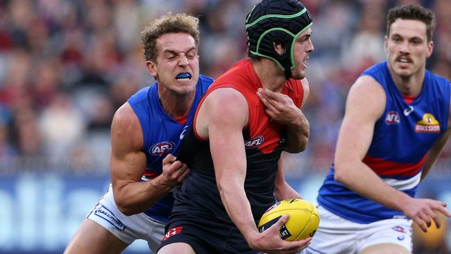 Mitch Wallis tackles Angus Brayshaw.