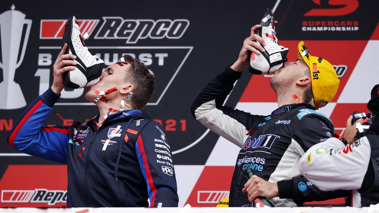 Team owner Ryan Walkinshaw and lead driver Chaz Mostert celebrating with a Shoey after winning the Repco Bathurst 1000. Picture: Tim Hunter.