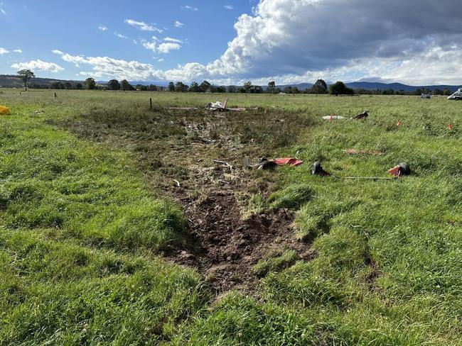 The length of the wreckage on the ground was about 30m, with part of the plane igniting upon impact. Picture: ATSB