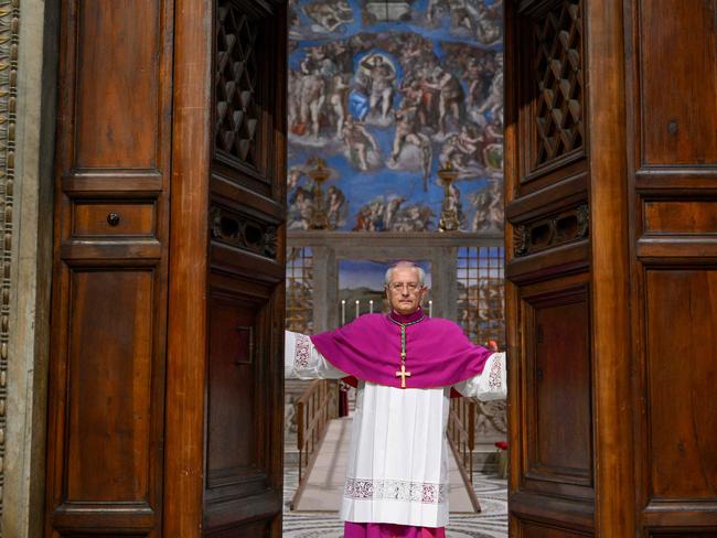 Diego Giovanni Ravelli, Master of Pontifical Liturgical Celebrations, closes the doors of the Sistine Chapel. Picture: AFP