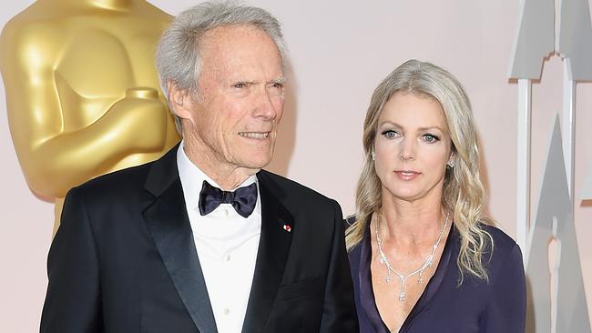 HOLLYWOOD, CA - FEBRUARY 22:  Director Clint Eastwood (L) and Christina Sandera attend the 87th Annual Academy Awards at Hollywood & Highland Center on February 22, 2015 in Hollywood, California.  (Photo by Jason Merritt/Getty Images)