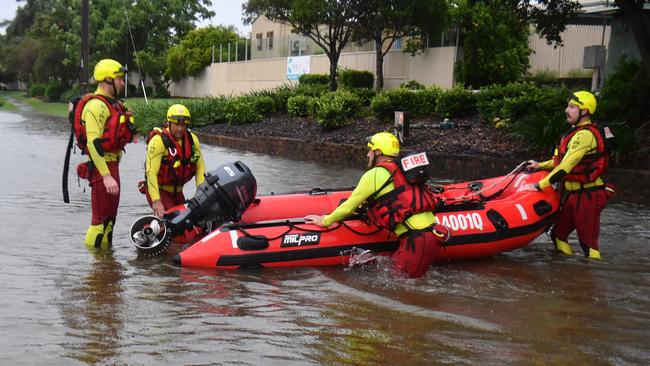 Heavy rain lashes Townsville causing flash flooding. Fire and Rescue Swiftwater Rescue Firefighters search for missing woman  opposite Castletown and back to the Causeway. Picture: Evan Morgan