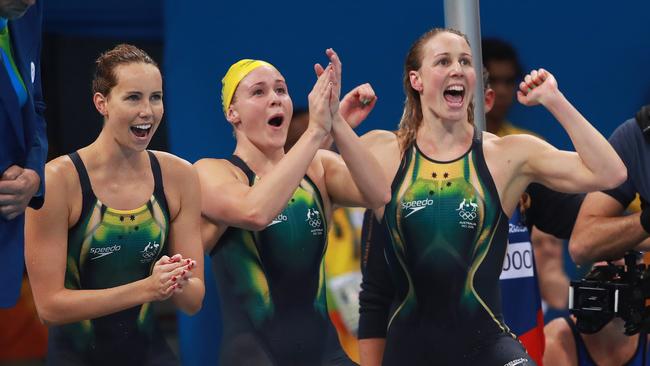 Australia's relay team celebrate as Tamsin Cook touches the wall in second place