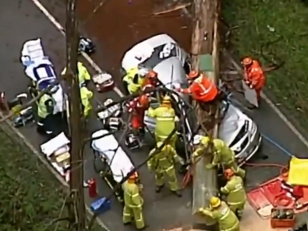 A woman died and a child is fighting for life after a car crashed into a tree on the Black Spur Road at Fernshaw, near Healesville, amid wild weather conditions.