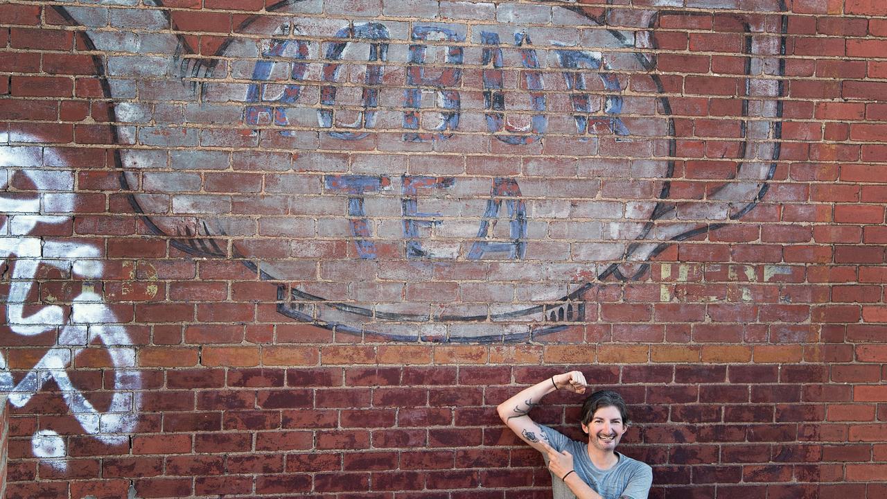 Sean Reynolds liked the Robur Tea sign so much he got it tattooed on his bicep. Picture: Supplied