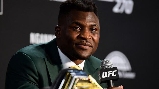 Champion Francis Ngannou takes questions in the press room after defeating French Cyril Gane in their UFC 270 championship fight in Anaheim on January 22, 2022. (Photo by Frederic J. BROWN / AFP)